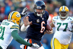 Jay Cutler trying to avoid a sack from Charles Woodson.